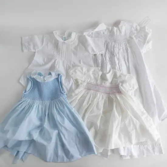 Four smocked baby dresses…